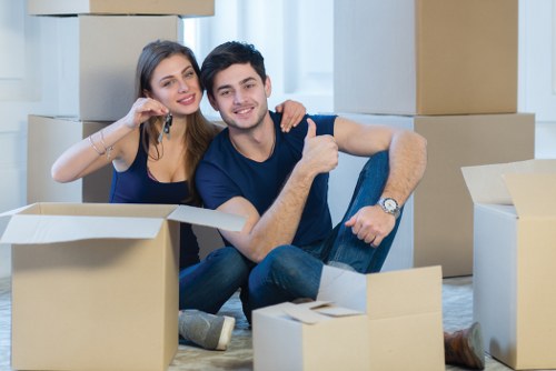 Local moving team handling furniture and boxes in West Hampstead