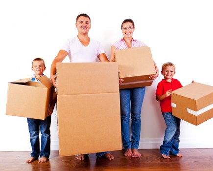House movers loading boxes in West Hampstead outside a residential property