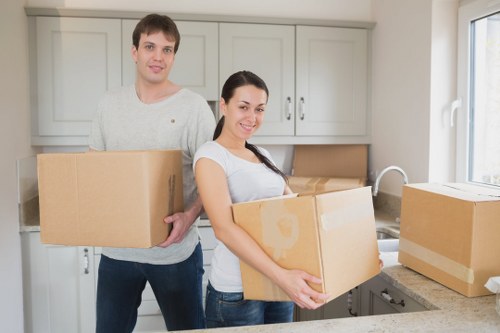 Removal team packing furniture for a West Hampstead home move